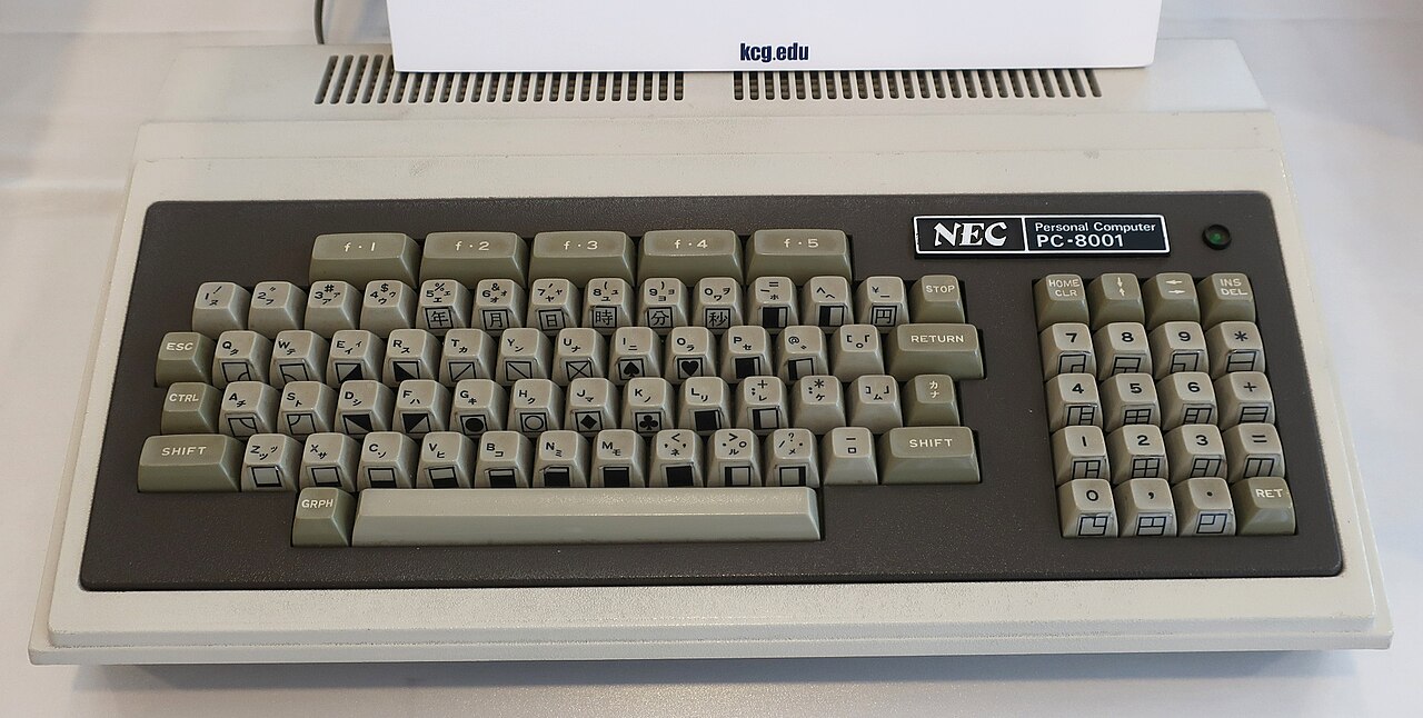 NEC PC-8001 vintage keyboard with Japanese key labels on display